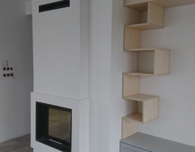 Nasze realizacje - Nowoczesne NR-N-248 - Kominek nowoczesny z wkładem Hajduk z szybą przesuwaną do góry. Wokół wkładu zastosowano czarny granit.
